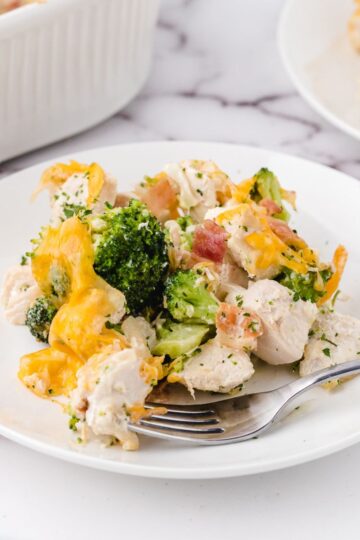 a plate of chicken bacon ranch casserole on a plate with a fork