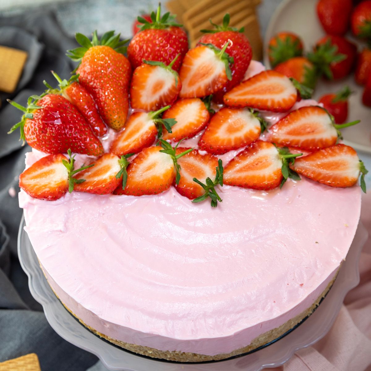 Easy No Bake Strawberry Cheesecake topped with sliced strawberries