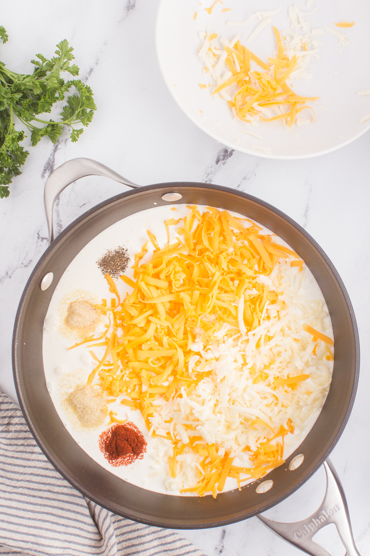 process of combining ingredients making mac and cheese