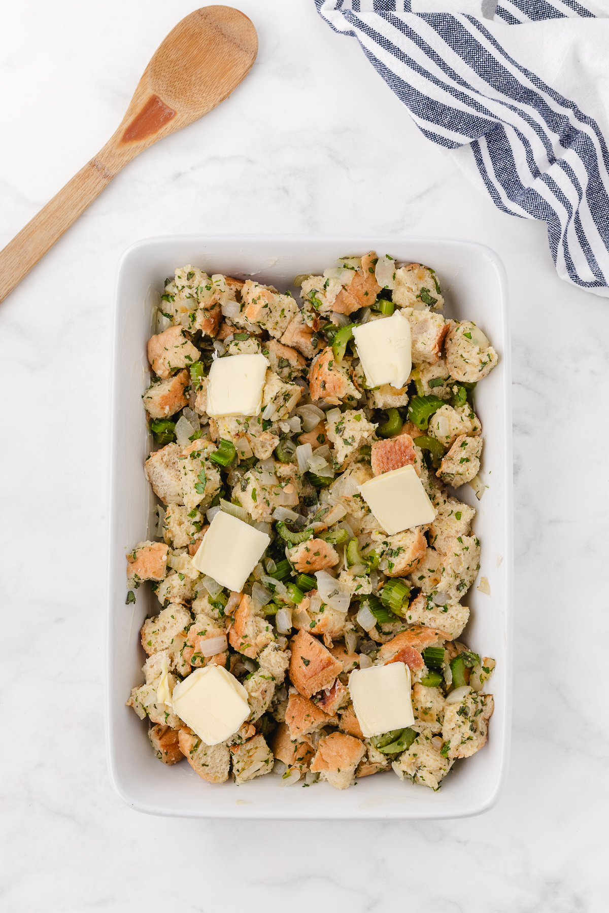 combining the stuffing ingredients and putting them in a 9x13 pan