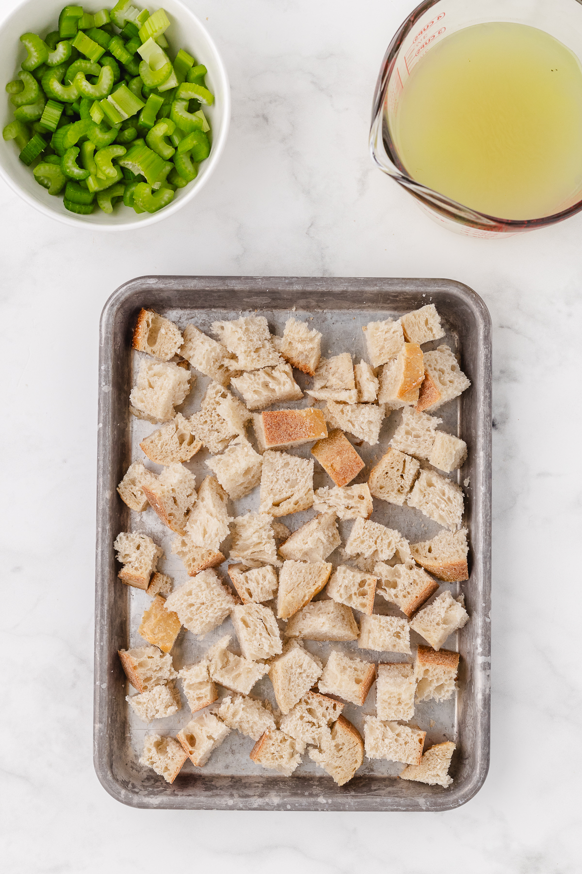 drying out the bread cubes on a sheet pan for stuffing