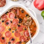 Old Fashioned Pizza Casserole in a white casserole dish sitting on the table