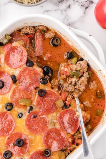 Old Fashioned Pizza Casserole in a white casserole dish sitting on the table