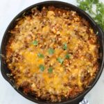 easy ground beef taco casserole topped with cheese and ready to serve