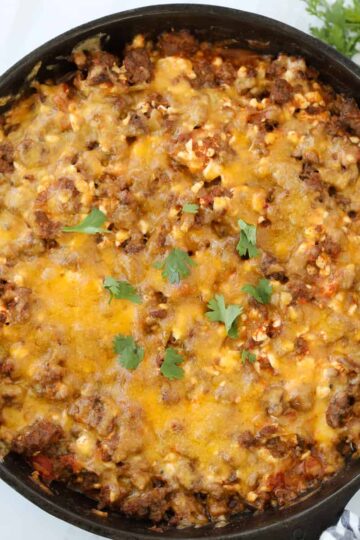 easy ground beef taco casserole topped with cheese and ready to serve