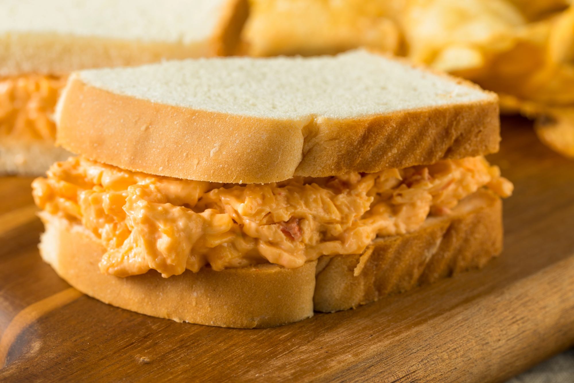 old fashioned pimento cheese sandwich with sharp cheddar and mayo between two slices of thick white bread