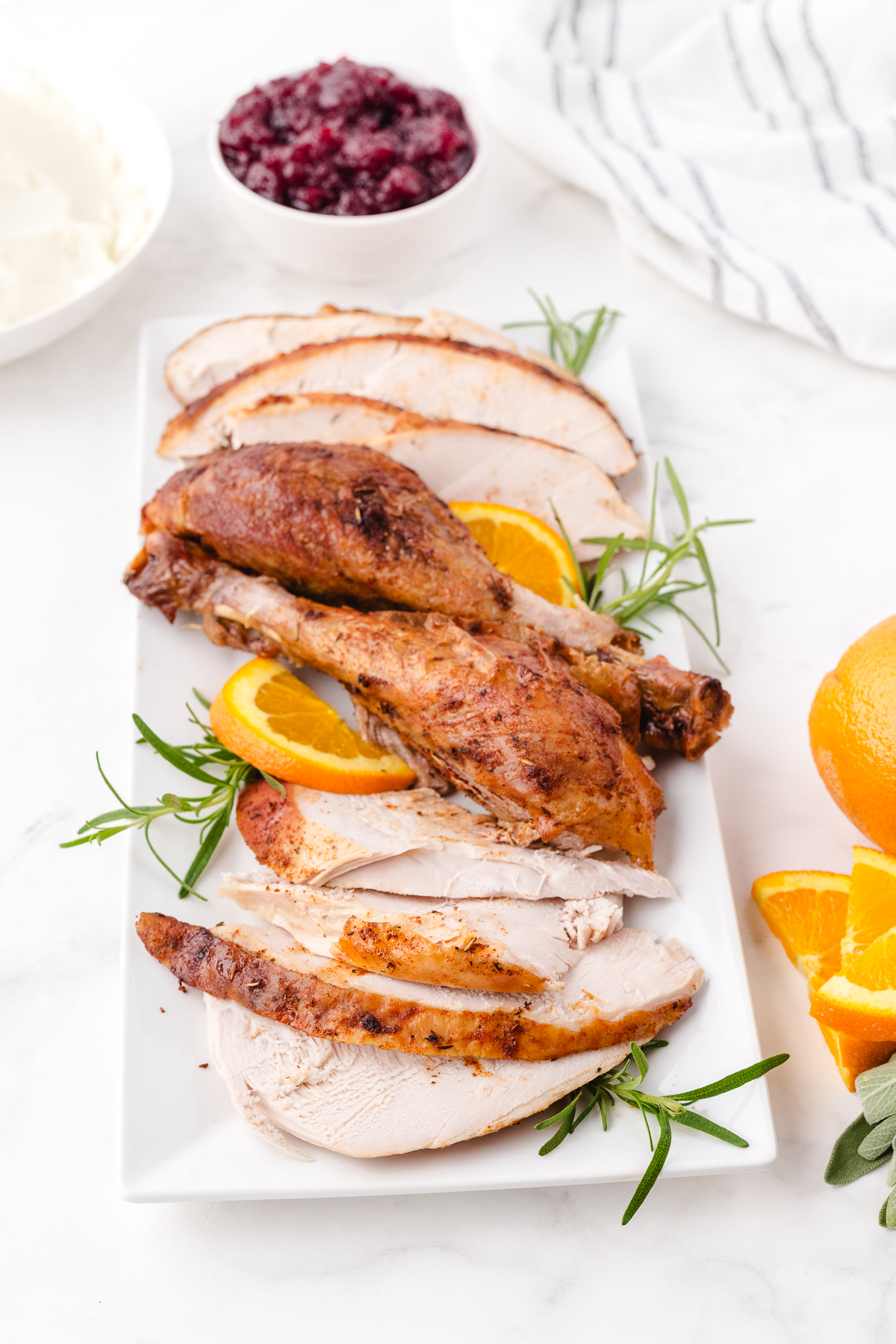 sliced roast turkey on a serving platter