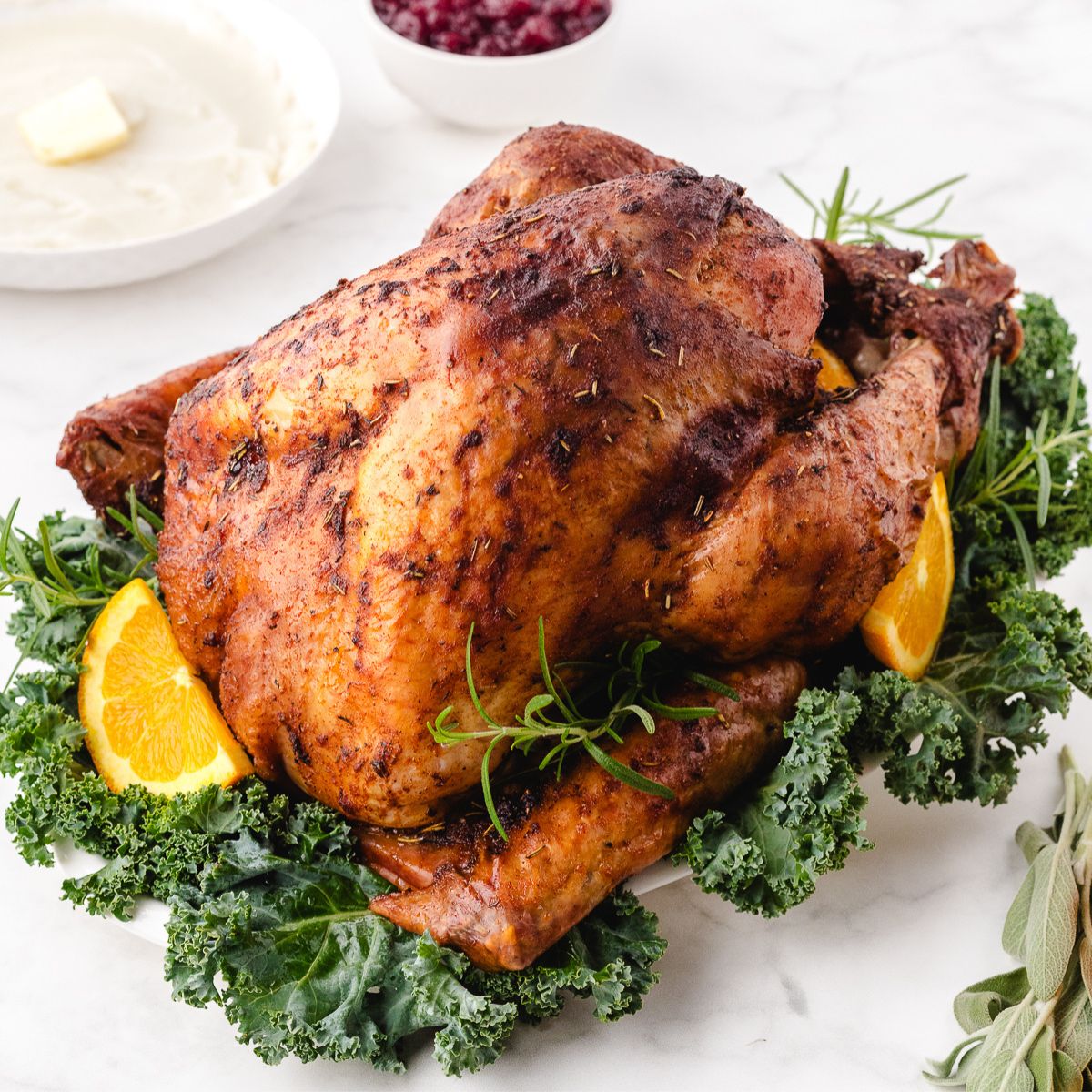 beautiful roasted turkey sitting on the dinner table