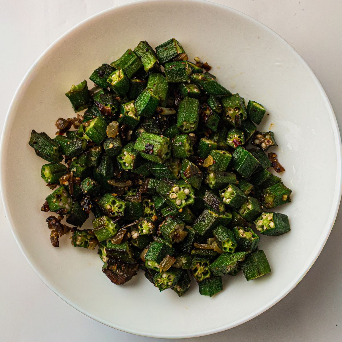 Old Fashioned Pan Fried Okra On White Plate