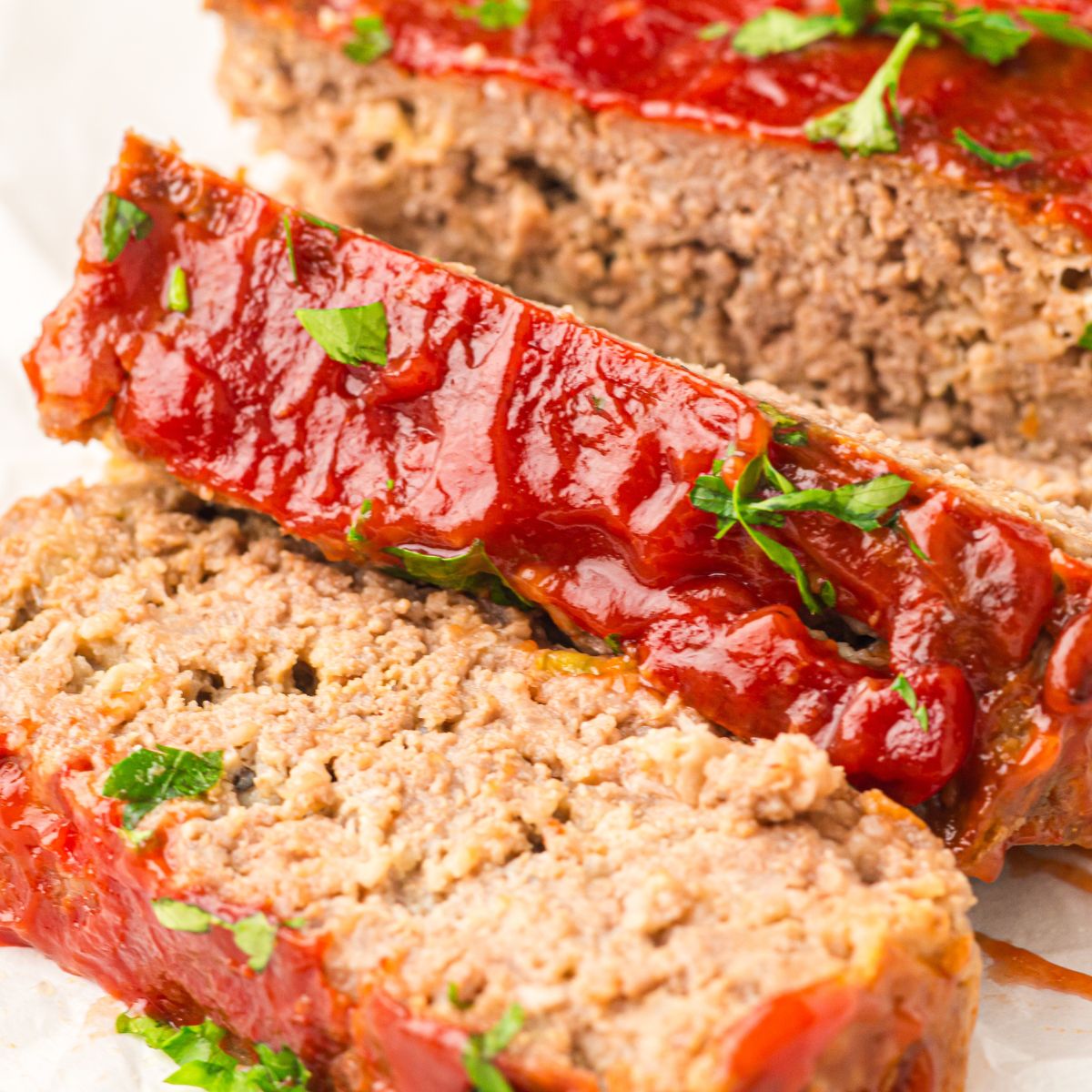 Sliced meatloaf served on a plate.