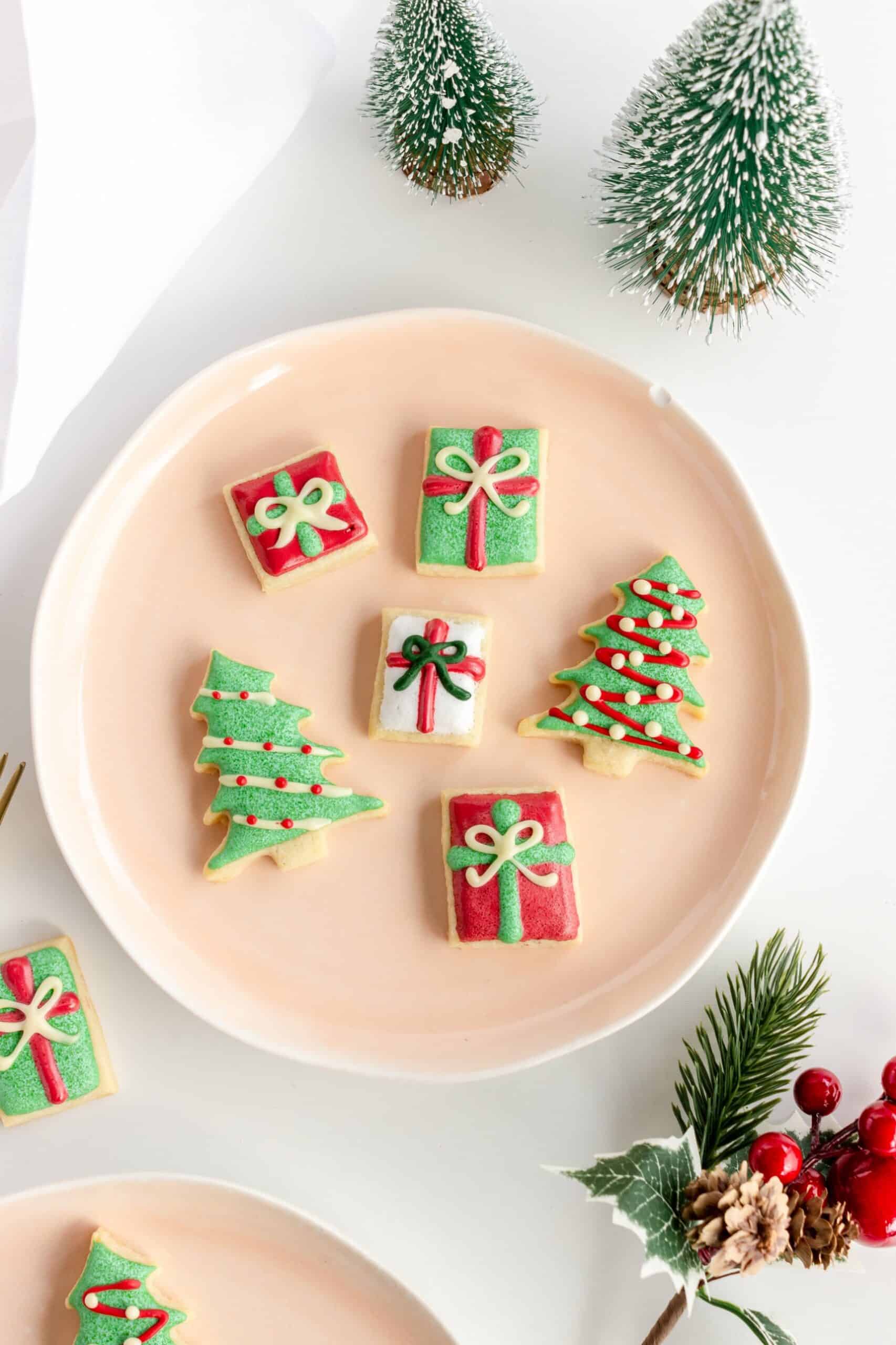 Old fashioned butter cookies for Christmas decorated with royal icing on a plate