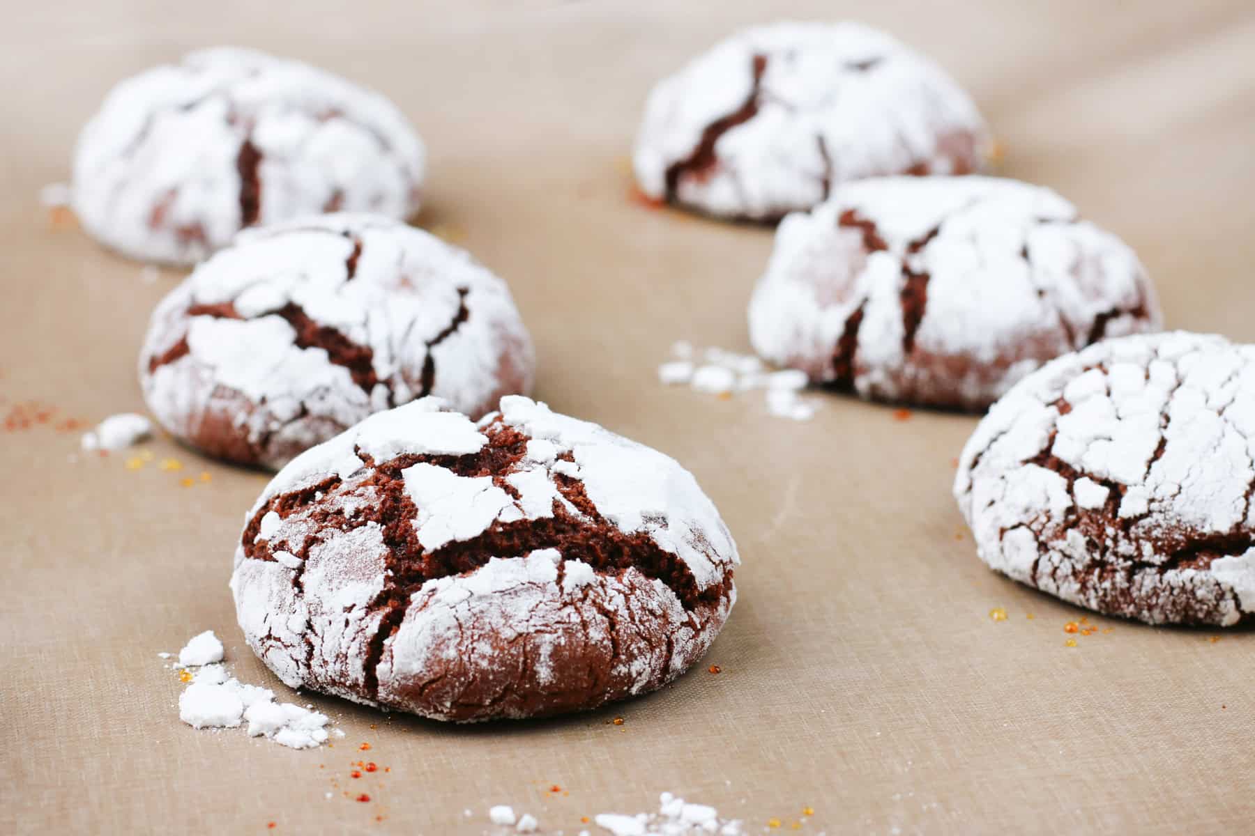 Close-up of old fashioned chocolate crinkle cookies with fudgy cracked tops