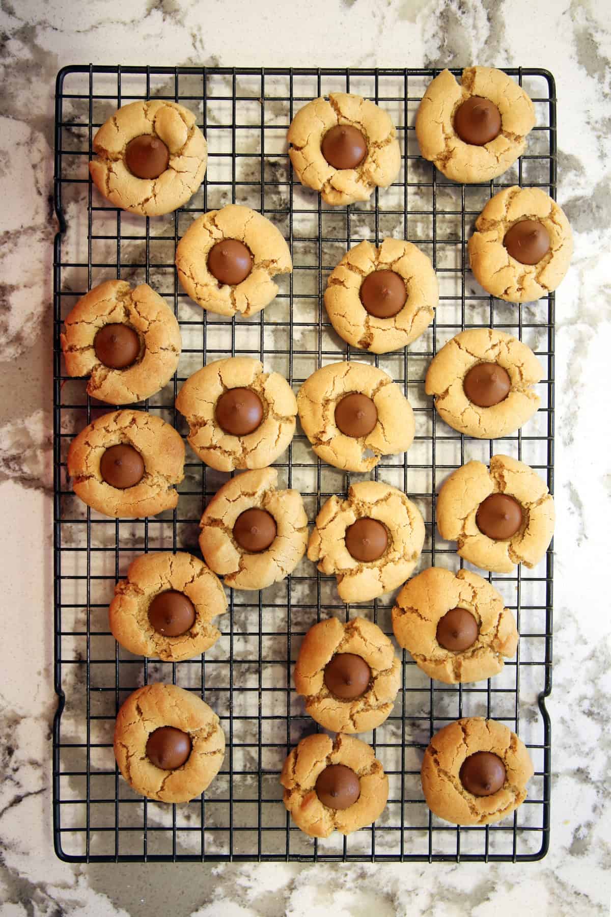 Easy peanut butter blossoms cooling on a wire rack