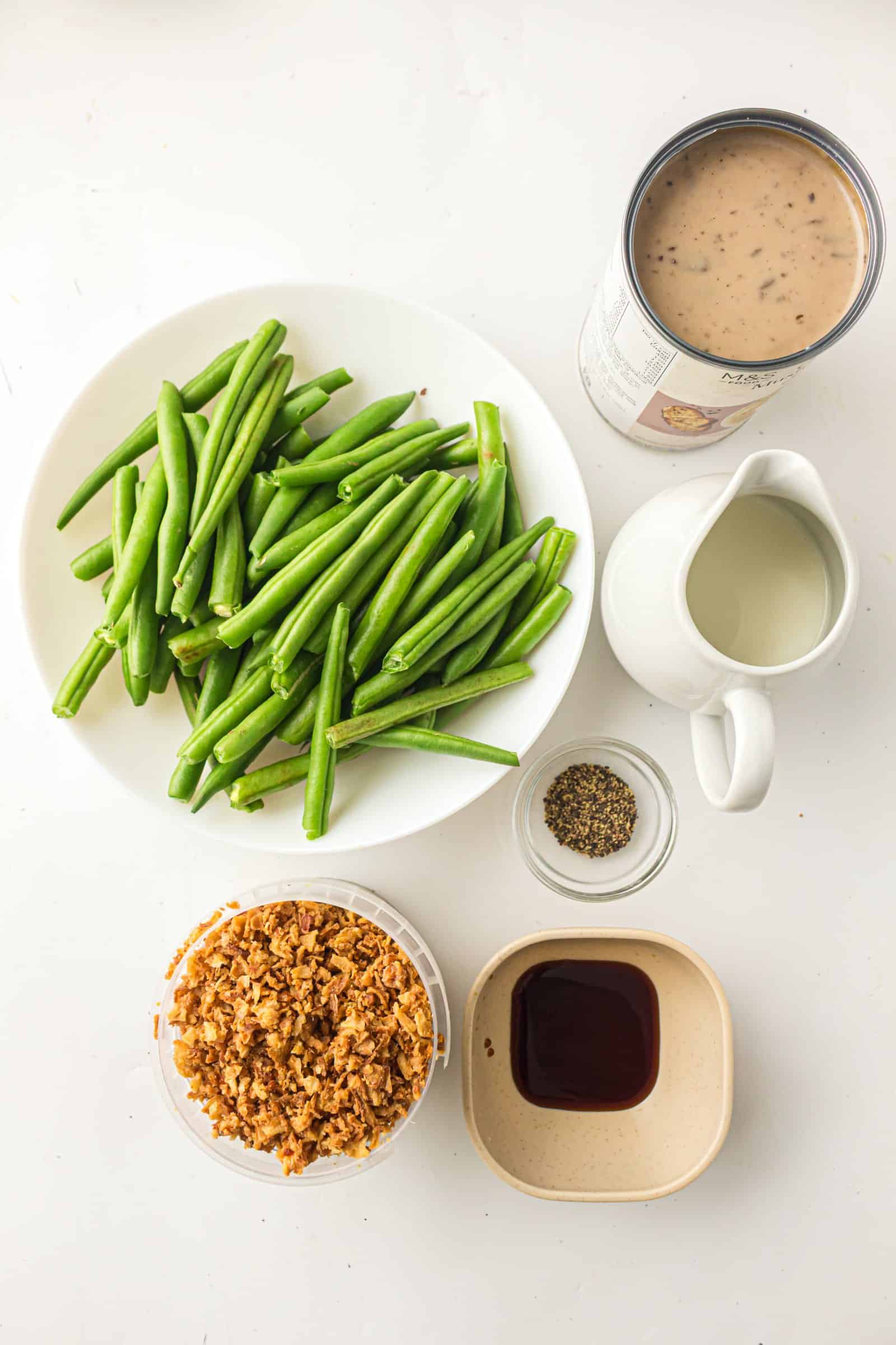Ingredients for green bean casserole with cream of mushroom soup.