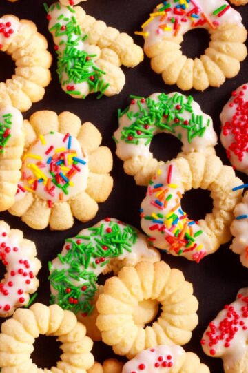 Easy spritz cookie wreaths and flowers with icing and sprinkles