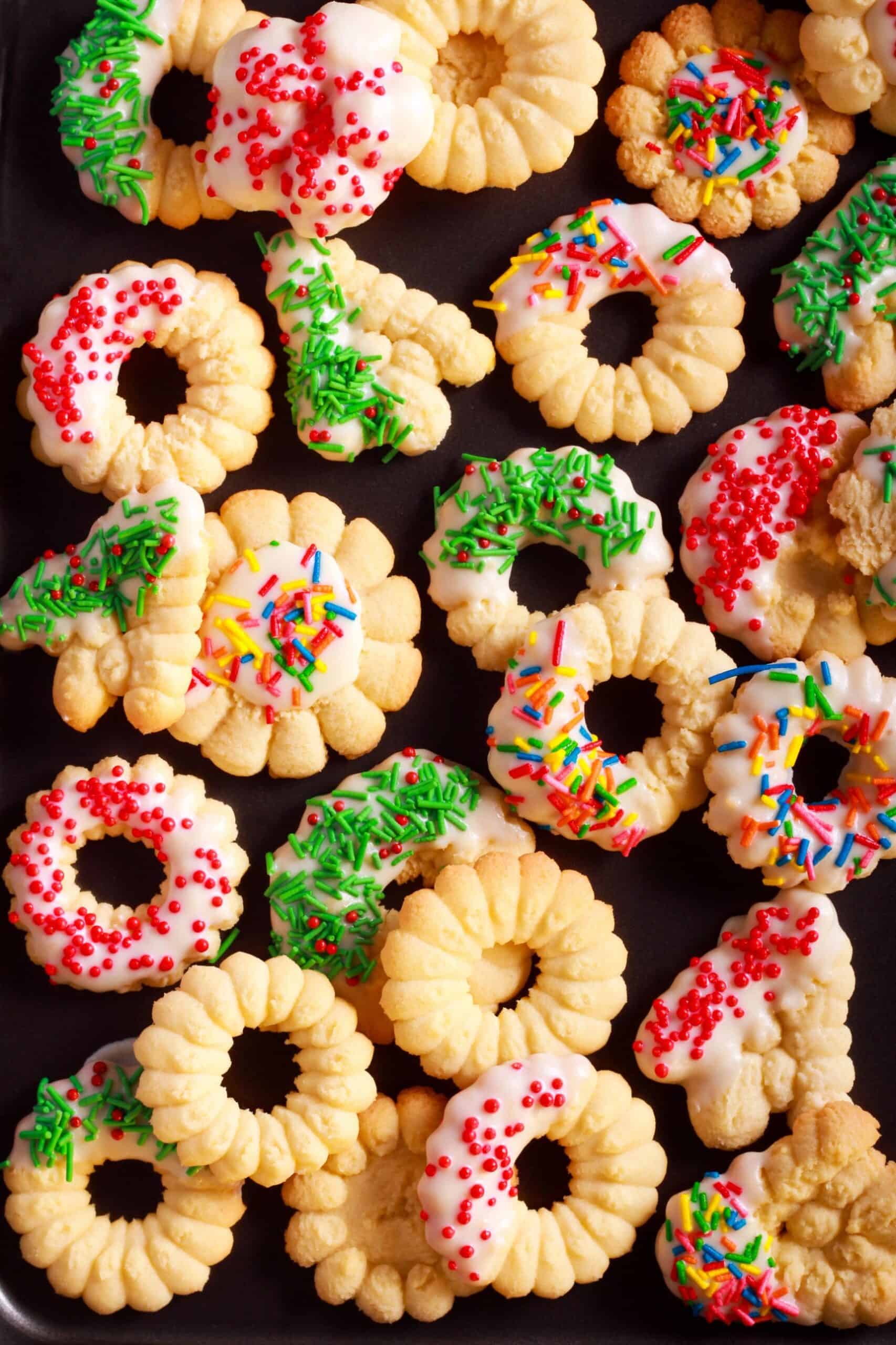 Easy spritz cookie wreaths and flowers with icing and sprinkles