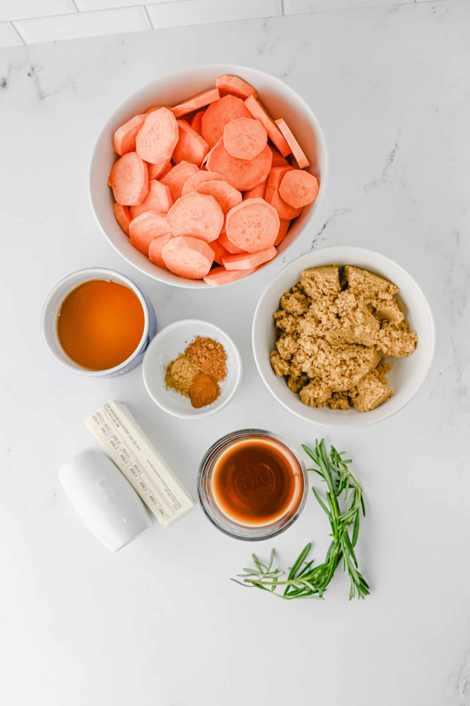 Ingredients for old fashioned candied sweet potatoes: sweet potatoes, butter, brown sugar, maple syrup and spices.