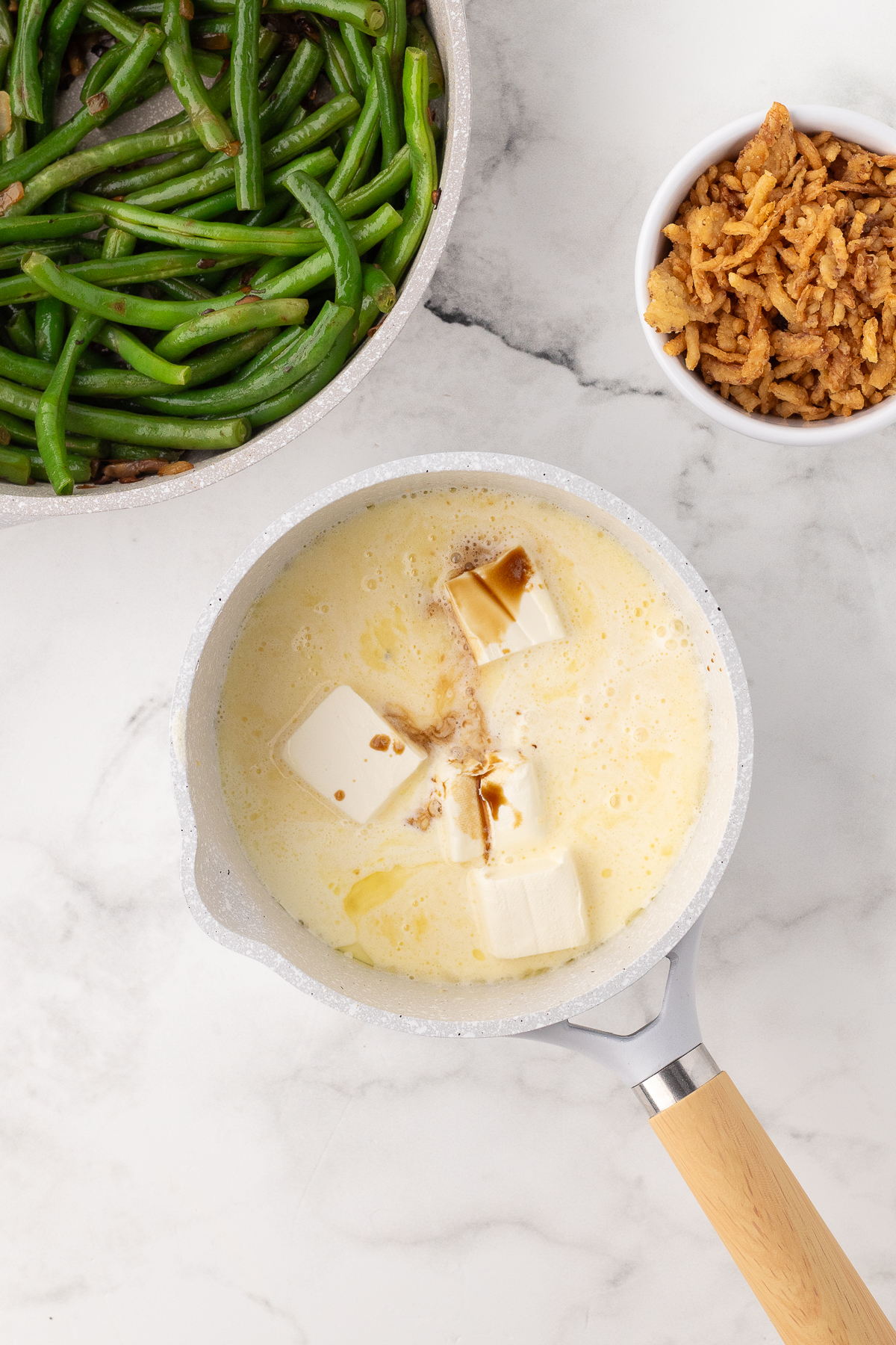 Old fashioned homemade green bean casserole making the cheese sauce