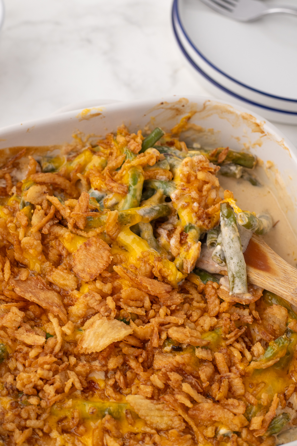 Old fashioned homemade green bean casserole with crispy fried onions